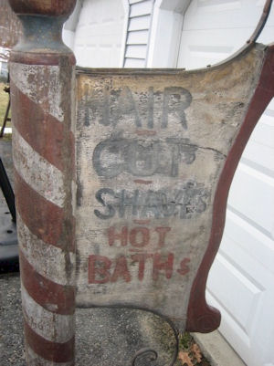 Folk art barber pole & sign brought nearly $1,900 at auction