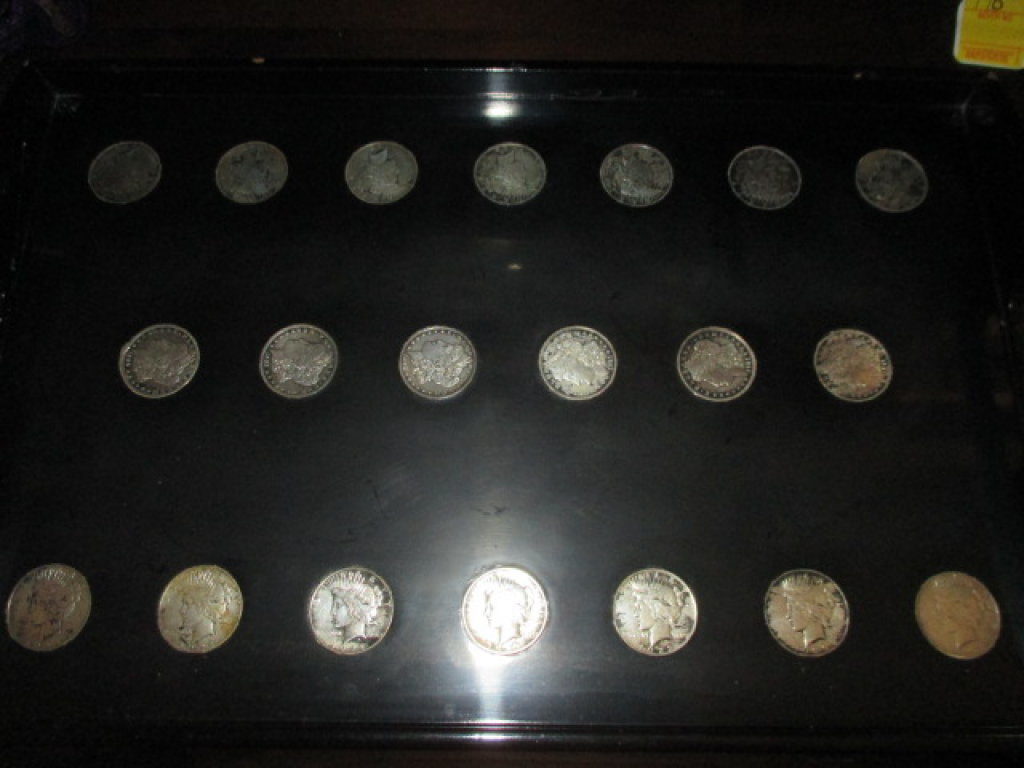 Tray with inset Morgan silver dollars and Peace dollars